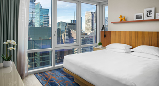 Image of a single bed in a Time Square-View Suite.