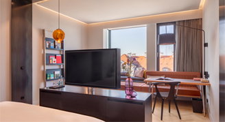 Image of the Andaz City-View Room open to the sitting area and window.