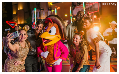Image of park goers taking a picture with Panchito.