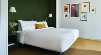 Image of a single bed in a Park MGM Restore Room.