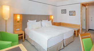 Triple room with green chair and love chair