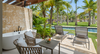 Image of a patio with chairs open to the resort.