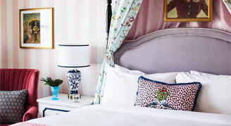 The Graduate Room featuring a king bed and hearing accessibility features.