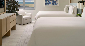 A suite at Loews Miami Beach Hotel with 2 queen beds and spacious pace