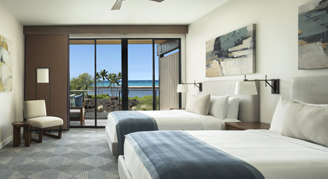 A view of a room with two beds and a balcony.