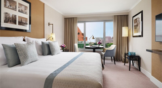 Photo of hotel room with large windows.