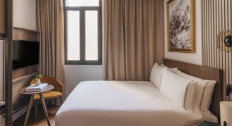 Photo of hotel room with king bed.