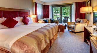 Image of a single bed leading to a patio in a Retreat Room.