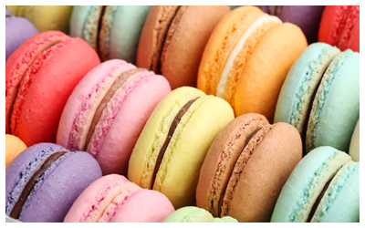 Image of macarons stacked in a row.