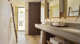 Image of the bathroom sink in a Tropical Garden Room.