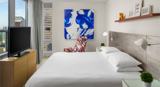 Image of a single bed in a Times Square Premier Suite.