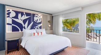 A room with a view, one bed, and a balcony.