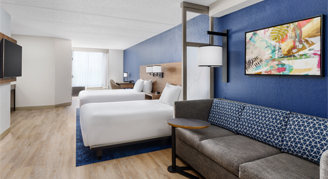 Image of two beds in a Room.