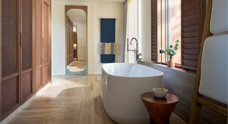 Image of a bathroom with a soaking tube in a Beach Area Suite with Plunge Pool.