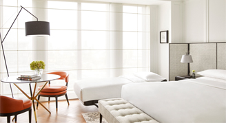 Image of a bed and rollaway bed in a Guest Room.