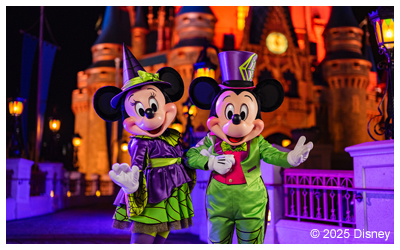 Mickey and Minnie Mouse posing in Halloween-themed clothes.