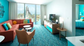 Image shows living area with turquoise theme color ensemble and a background view of volcano view.