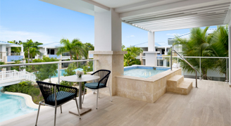Photo of hotel room balcony with private plunge pool and seating area.