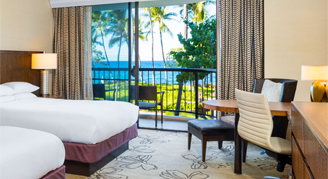 Image of a two beds in a Makai Oceanfront Room.