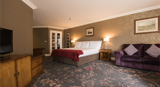 Image of a single bed in a Family Studio Room.