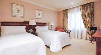 Premium room with two twin bed and chair with desk