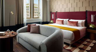 junior suite with burgundy bed headboard