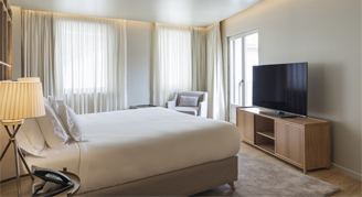 Image of a single bed in a Cathedral-View Premium Room.
