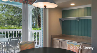 Hearing accessible villa featuring a dining area with a view of a patio.