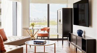 Image of a living area with floor-to-ceiling windows in a Park Suite.