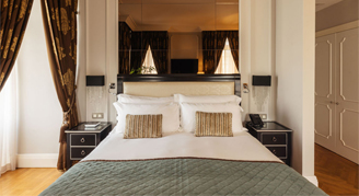 Image of a single bed in a Premium Room.