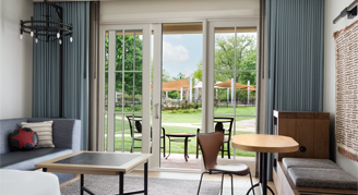 A room with living room area and patio view
