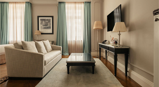 Image of a living are and small table in a Junior Suite.