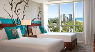 Image of two beds in the Two Bedroom Coastline Room at Palm Beach Marriott Singer Island Beach Resort & Spa.