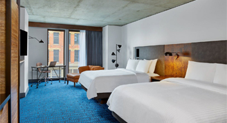 Photo of two queen beds.