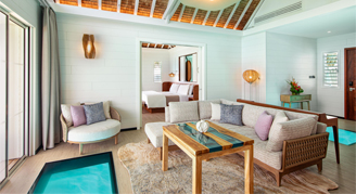 Image of a living area leading to a bedroom in a One-Bedroom Royal Otemanu-View Overwater Villa with Plunge Pool..