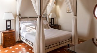 Image of a single bed in a Suite with Balcony.
