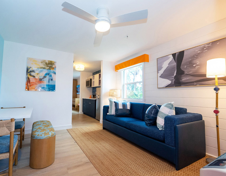 Image of the living room featuring a couch in a One-Bedroom Suite.
