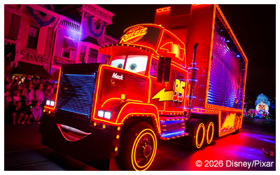 Photo of Pixar truck lit up at night.