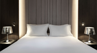 Image of a single bed in a Luxury Room.