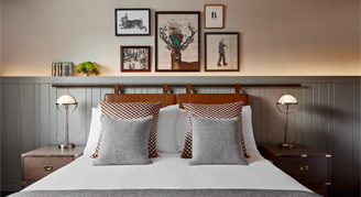 Premium room with a view of a double bed and two bed tables with lamps