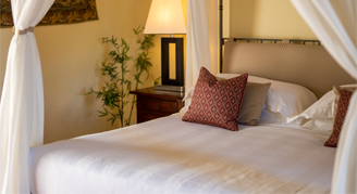 Image of a single bed in a Deluxe Room.