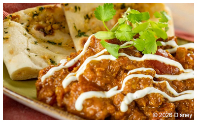 Image of fish on beans with a cream sauce in a bowl.