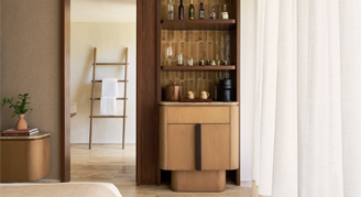 Image of shelves a a bit of bed in an Ocean-View Room.