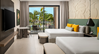 Photo of Club Azure Tropical-View Room with two queen beds.