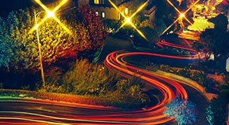 Artist's rendering of car tail light going down a hill in San Francisco. Copyright NFL