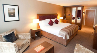 Image of a two beds pushed together in a Retreat Room.