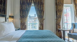 Image of a single bed in a Premium Room.