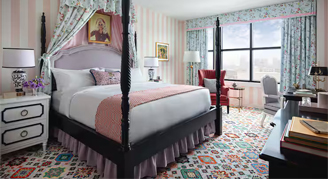 The Graduate Room featuring one king bed and a city view.