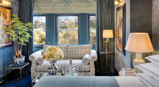 Image of a bed and seating area in a Junior Suite.