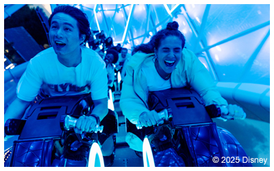 Image of park guests on the ride TRON Lightcycle.